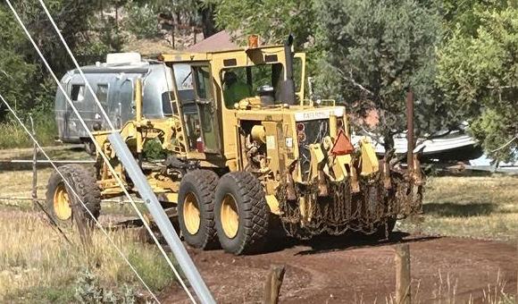 Road grader at work in Colcord Mountain Estates